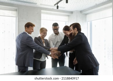 Happy Multiethnic Successful Business Group Celebrating Success, Teamwork Achieve, Making Hand Stack, Keeping High Motivation, Friendship, Community Spirit, Laughing, Having Fun. Corporate Friendship