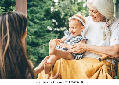 Happy multi-generation family having fun on porch. - Powered by Shutterstock