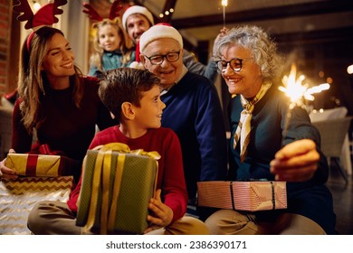 Happy multigeneration family having fun on Christmas eve at home. - Powered by Shutterstock