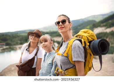 Happy Multigeneration Family On Hiking Trip On Summer Holiday, Walking.