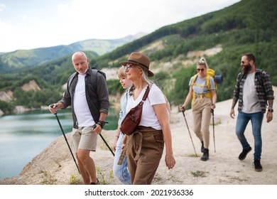 Happy Multigeneration Family On Hiking Trip On Summer Holiday, Walking.