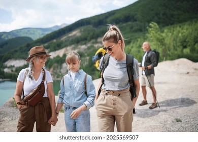 Happy Multigeneration Family On Hiking Trip On Summer Holiday, Walking.