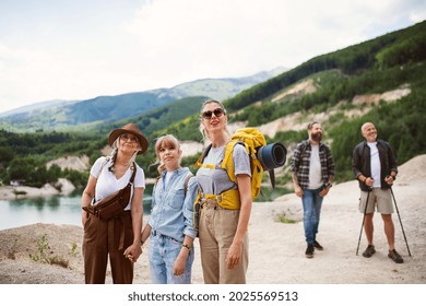 Happy Multigeneration Family On Hiking Trip On Summer Holiday, Walking.