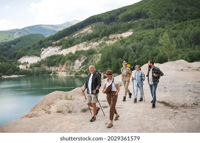 Happy Multigeneration Family On Hiking Trip On Summer Holiday, Walking.