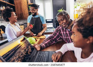 Happy multigenerational african american family make dinner together. - Powered by Shutterstock