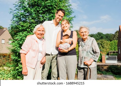 Happy Multi-generational Family With Newborn Baby Outdoors - Kempen, Germany