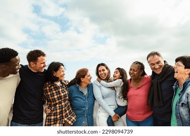 Happy multigenerational friends with different ethnicity having fun at house rooftop - Diversity people lifestyle - Powered by Shutterstock
