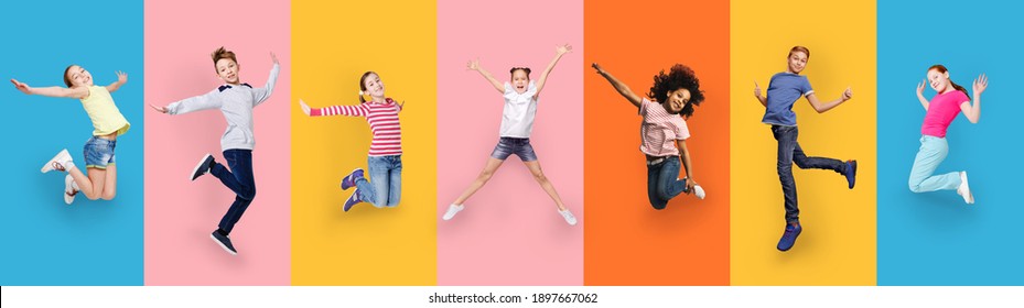 Happy Multiracial Children Jumping Posing On Different Colored Backgrounds. Row Collage With Carefree Kids, Cheerful Boys And Girls Jump In Studio. Joyful Childhood And Fashion Concept. Panorama