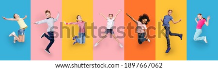Happy Multiracial Children Jumping Posing On Different Colored Backgrounds. Row Collage With Carefree Kids, Cheerful Boys And Girls Jump In Studio. Joyful Childhood And Fashion Concept. Panorama