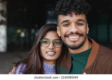 Happy Multiracial Couple Smiling On Camera