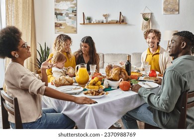 happy multiracial family and friends talking and smiling during Thanksgiving dinner, festive joy - Powered by Shutterstock