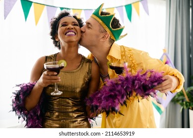 Happy Multiracial Friends Having Fun And Drinking Cocktails At The Party During Mardi Gras Celebration. 