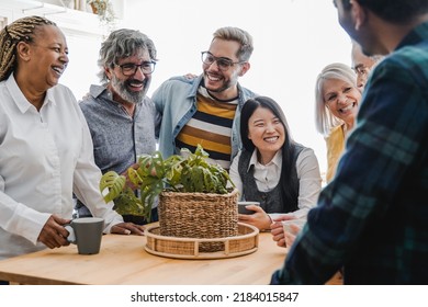 Happy multiracial friends having fun together at home kitchen - Focus on Asian girl face - Powered by Shutterstock