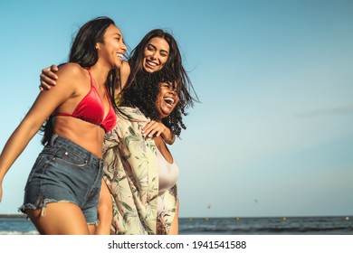 Happy Multiracial Girls With Different Body Size Having Fun On The Beach During Summer Holidays