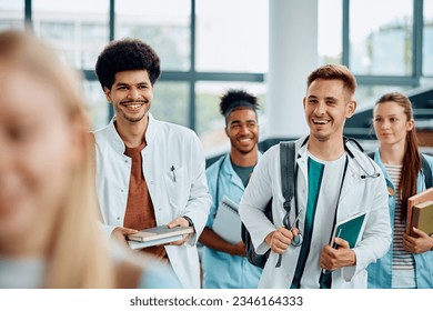 Happy multiracial medical students going to a lecture at the university amphitheater. - Powered by Shutterstock