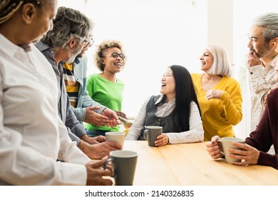 Happy Multiracial People With Different Ages And Ethnicities Having Fun Drinking A Cup Of Coffee At Home