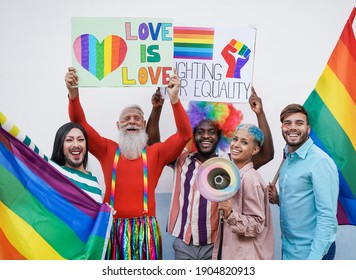 Happy Multiracial People At Gay Pride Parade With Banner And Rainbow Flag - Concept Of Lgbt And Homosexual Love