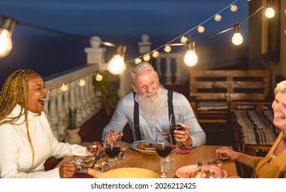 Happy Multiracial Senior Friends Having Fun Dining Together On House Patio - Elderly Lifestyle People And Food Concept