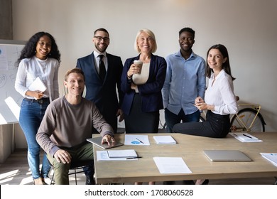 Happy Multiracial Team Posing Together In Modern Office Show Unity And Support At Work, Group Portrait Of Smiling Multicultural Diverse Businesspeople At Workplace, Teamwork, Cooperation Concept