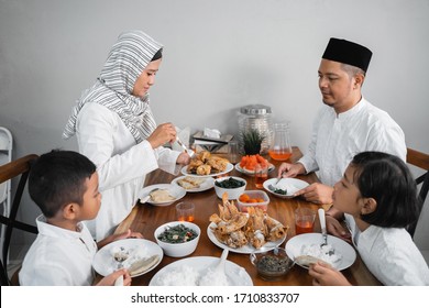 Happy Muslim Asian Family Having Sahoor Or Sahur Breakfast During Ramadan