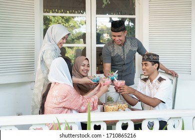 Happy Muslim Asian Family Having Sahoor Or Sahur Breakfast During Ramadan