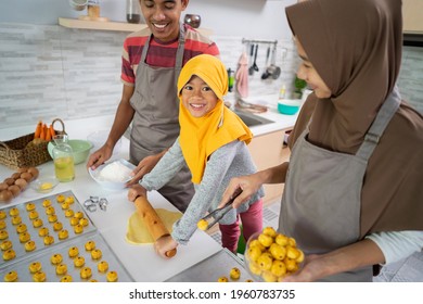 Happy Muslim Family With Hijab Making Nastar Cake Together At Home. Beautiful Parent And Child Cooking Activity For Eid Mubarak