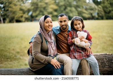 Happy Muslim family relaxing in nature and looking at camera. - Shutterstock ID 2160508771
