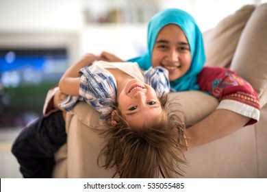 Happy Muslim Middle Eastern Mother With Son At New Modern Home Family At New Modern Home