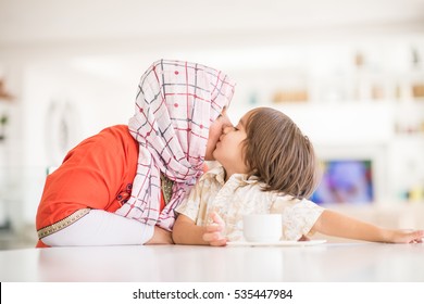 Happy Muslim Middle Eastern Mother With Son At New Modern Home Family At New Modern Home