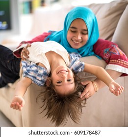 Happy Muslim Middle Eastern Mother With Son At New Modern Home Family At New Modern Home