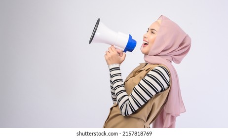 Happy Muslim Woman Is Announcing With Megaphone On White Background 