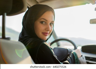 Happy Muslim Woman Driving Car