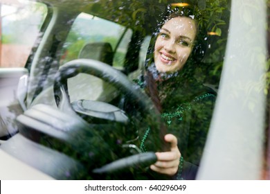 Happy Muslim Woman Driving Car