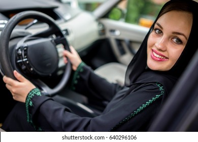 Happy Muslim Woman Driving Car