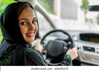 Happy Muslim Woman Driving Car