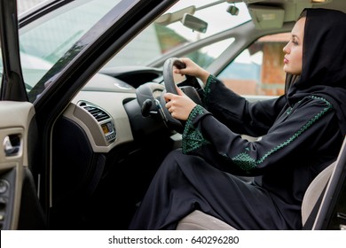 Happy Muslim Woman Driving Car