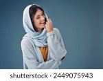 Happy, muslim woman and scarf in portrait for love of faith or religion isolated in studio. Islamic, female model and fashion with hijab, smile and casual style with mockup or promotional space