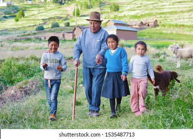 Happy Native American Family In The Countryside. Grandfather And His Three Grandchildren.