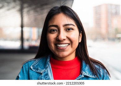 Happy native American young woman smiling in camera - Shutterstock ID 2212201005