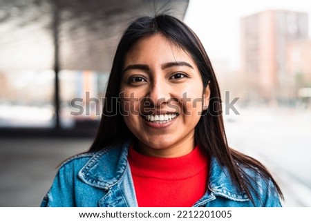 Happy native American young woman smiling in camera