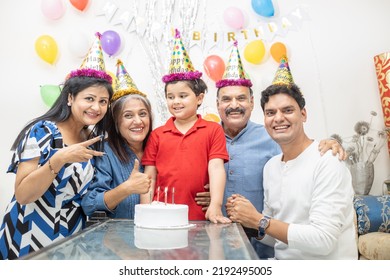 Happy Ndian Asian Multi Generational Family Celebrate Children's Birthday Party.