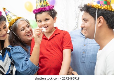 Happy Ndian Asian Multi Generational Family Celebrate Children's Birthday Party. Kid Eat Cake