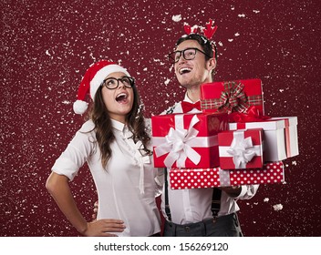 Happy Nerd Couple With Christmas Presents