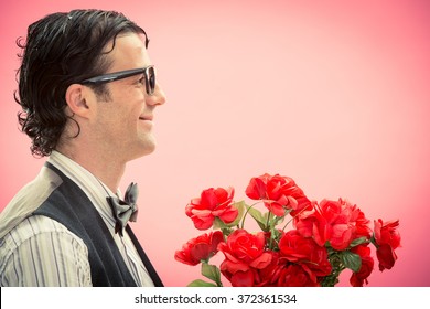 Happy Nerd Man With Glasses And Red Roses Flower Bunch Side View On Pink For Valentine Day