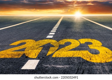 happy new 2023 year tyre track mark on asphalt as a metaphor for moving forward calender in happy new year background for greeting card design top slide cover calendar - Shutterstock ID 2205032491