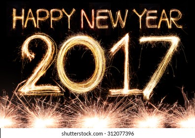Happy new year 2017 written with Sparkle firework - Shutterstock ID 312077396