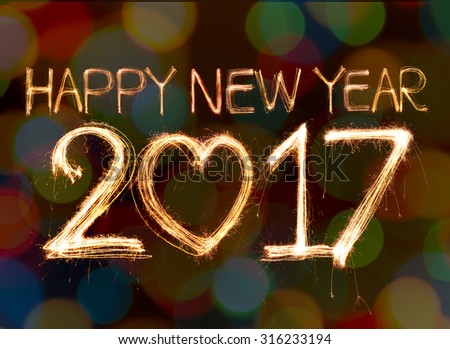 Happy new year 2017 written with Sparkling  light on bokeh background