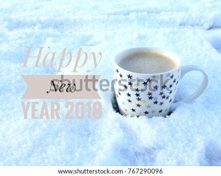 Happy New Year 2018, Greeting card with a cup of hot coffee put on real white snow background.