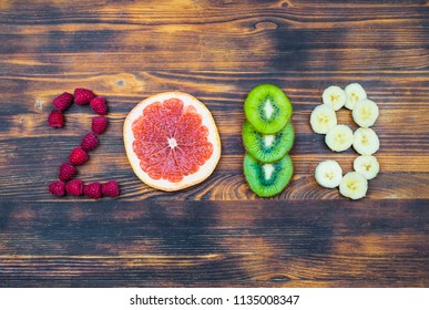 Happy New Year 2019 Of Fruit And Berries On Wooden Background.