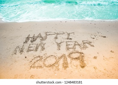 Happy New Year 2019, text on the beach. abstract background coming New Year 2019